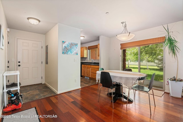 7552 Mountain Laurel Dr Unit D-3, Victor, ID 83455 - dining room with dark wood finished floors, baseboards, and electric panel