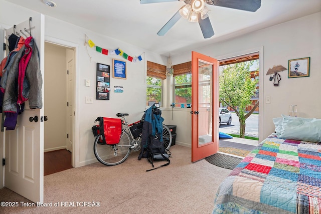7552 Mountain Laurel Dr Unit D-3, Victor, ID 83455 - carpeted bedroom featuring access to exterior, multiple windows, and baseboards