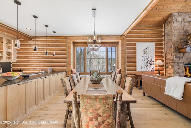 29 Bannock Cir, Victor, ID 83455 - dining area featuring log walls and light wood-type flooring