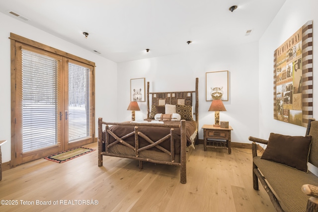 29 Bannock Cir, Victor, ID 83455 - bedroom with light wood-type flooring, french doors, access to outside, and baseboards