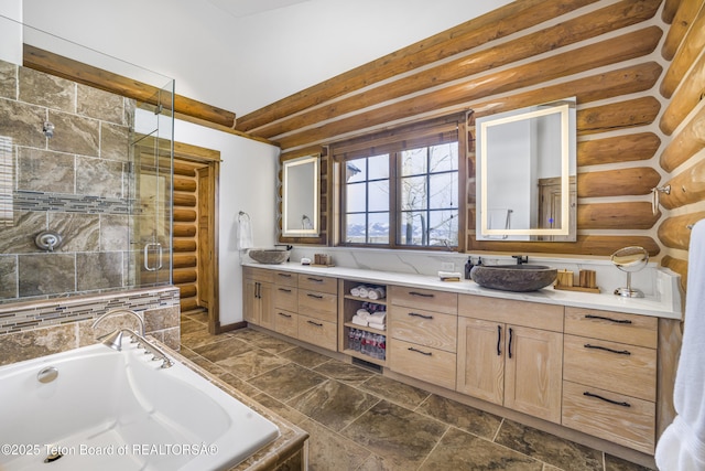 29 Bannock Cir, Victor, ID 83455 - full bath with double vanity, a stall shower, log walls, and a bath