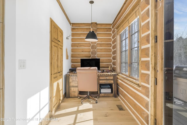 29 Bannock Cir, Victor, ID 83455 - office space featuring log walls, plenty of natural light, and light wood-type flooring