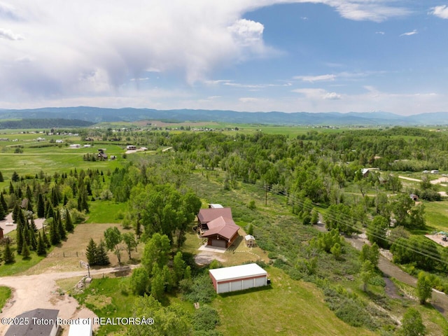 205 Betsy Ct, Bedford, WY 83112 - view from above of property with a mountain backdrop and a heavily wooded area