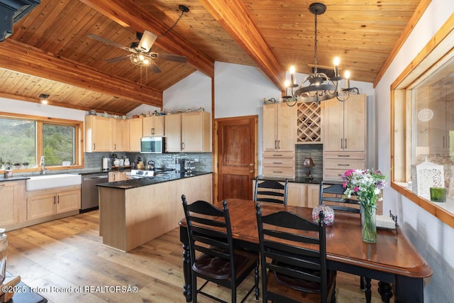 205 Betsy Ct, Bedford, WY 83112 - kitchen with light brown cabinetry, stainless steel appliances, a sink, dark countertops, and wooden ceiling