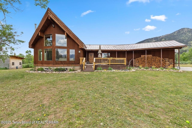 205 Betsy Ct, Bedford, WY 83112 - back of house with a yard, metal roof, and a deck with mountain view