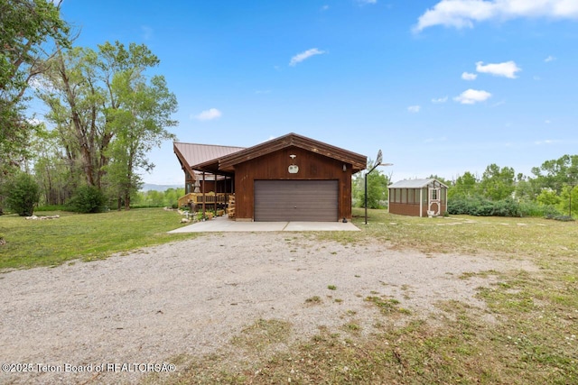205 Betsy Ct, Bedford, WY 83112 - garage with dirt driveway
