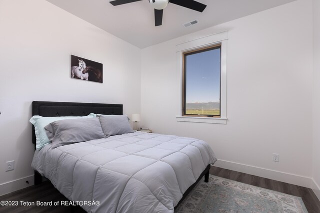 6118 Hatfield Way, Driggs, ID 83422 - bedroom featuring baseboards, wood finished floors, and ceiling fan