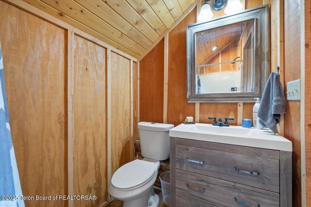 62 Skyline Dr, Bondurant, WY 82922 - bathroom with vaulted ceiling, toilet, vanity, and wood ceiling