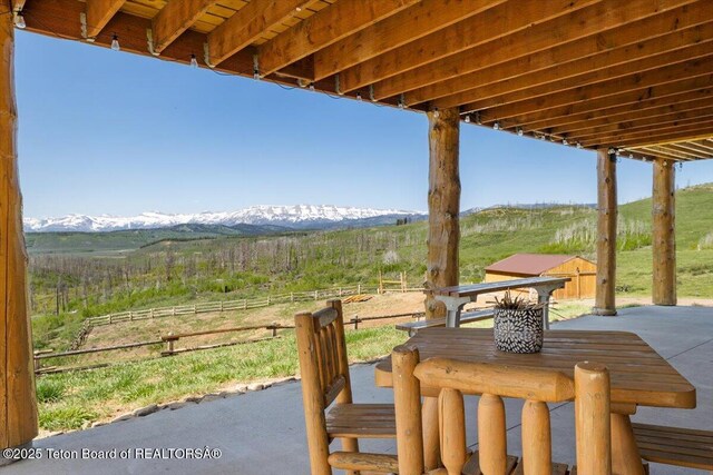 62 Skyline Dr, Bondurant, WY 82922 - view of patio featuring a mountain view and a rural view