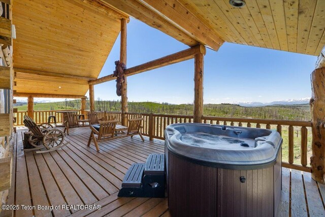 62 Skyline Dr, Bondurant, WY 82922 - wooden terrace featuring a hot tub and a mountain view