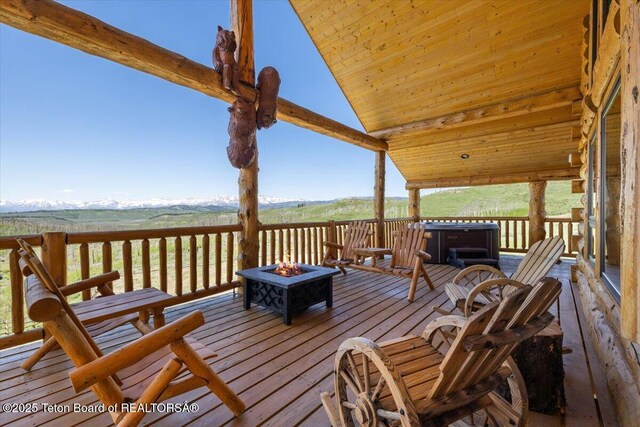 62 Skyline Dr, Bondurant, WY 82922 - wooden terrace with an outdoor fire pit and a mountain view