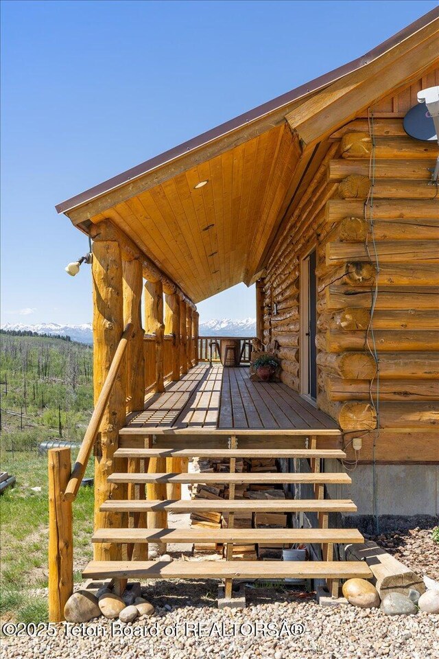 62 Skyline Dr, Bondurant, WY 82922 - property entrance featuring log exterior and a wooden deck