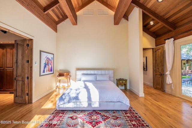 2540 Trader Rd, Jackson, WY 83001 - bedroom with a wooden ceiling with exposed beams, light wood-style flooring, and high vaulted ceiling