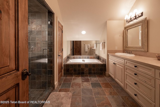2540 Trader Rd, Jackson, WY 83001 - full bathroom with vanity, a bath, a stall shower, stone finish flooring, and recessed lighting
