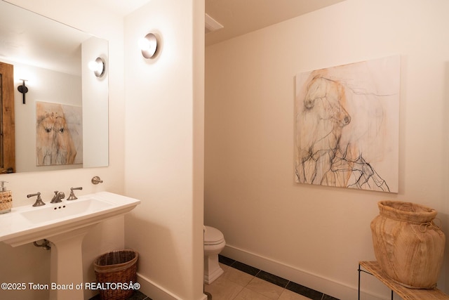 2540 Trader Rd, Jackson, WY 83001 - half bath featuring toilet and tile patterned flooring