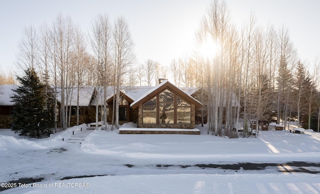 2540 Trader Rd, Jackson, WY 83001 - view of front of home featuring a chimney and stone siding