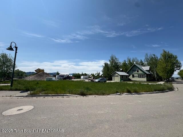 TBA Village Way, Victor, ID 83455 - view of asphalt street featuring curbs and street lighting