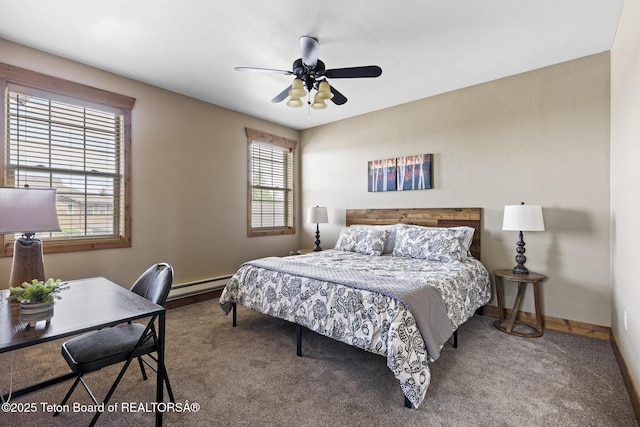 715 Moraine Ct Unit 36, Driggs, ID 83422 - carpeted bedroom featuring multiple windows, a baseboard radiator, and a ceiling fan