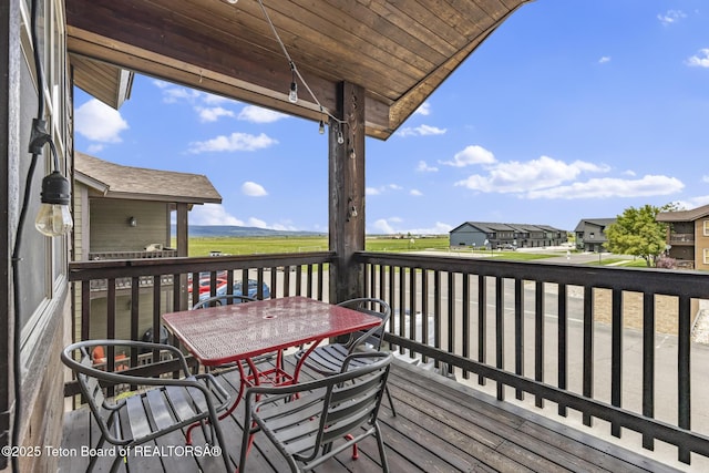 715 Moraine Ct Unit 36, Driggs, ID 83422 - wooden deck with outdoor dining space and a residential view