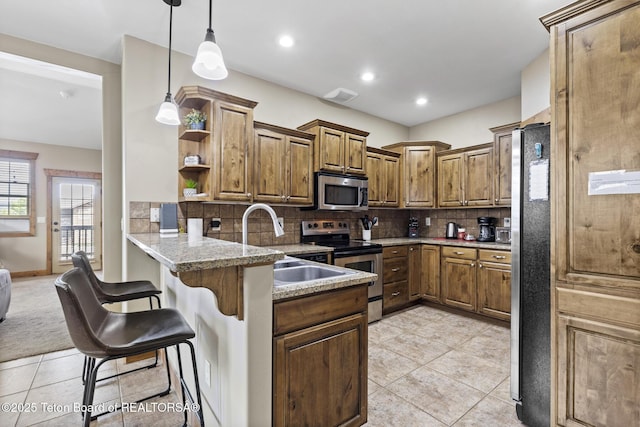 715 Moraine Ct Unit 36, Driggs, ID 83422 - kitchen featuring stainless steel appliances, a peninsula, open shelves, light tile patterned floors, and recessed lighting