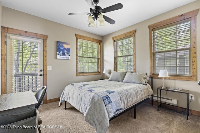 715 Moraine Ct Unit 36, Driggs, ID 83422 - bedroom featuring baseboard heating, carpet floors, and a ceiling fan