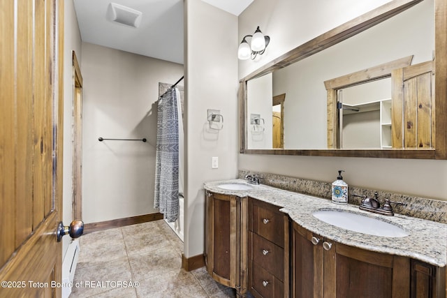 715 Moraine Ct Unit 36, Driggs, ID 83422 - full bathroom featuring double vanity, a shower with curtain, and tile patterned flooring
