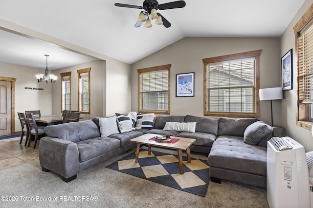 715 Moraine Ct Unit 36, Driggs, ID 83422 - living room featuring a ceiling fan, a chandelier, vaulted ceiling, and light carpet