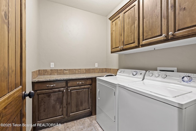 715 Moraine Ct Unit 36, Driggs, ID 83422 - laundry area with washing machine and clothes dryer, cabinet space, and light tile patterned floors