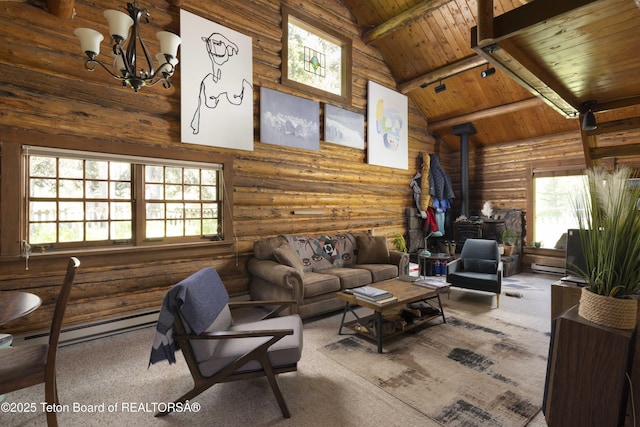 4075 Jarvis Ln, Wilson, WY 83014 - carpeted living room with high vaulted ceiling, a wood stove, wood ceiling with exposed beams, plenty of natural light, and rustic walls