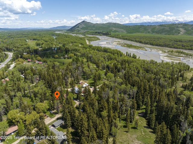 4075 Jarvis Ln, Wilson, WY 83014 - aerial view of property's location with a heavily wooded area and a water and mountain view
