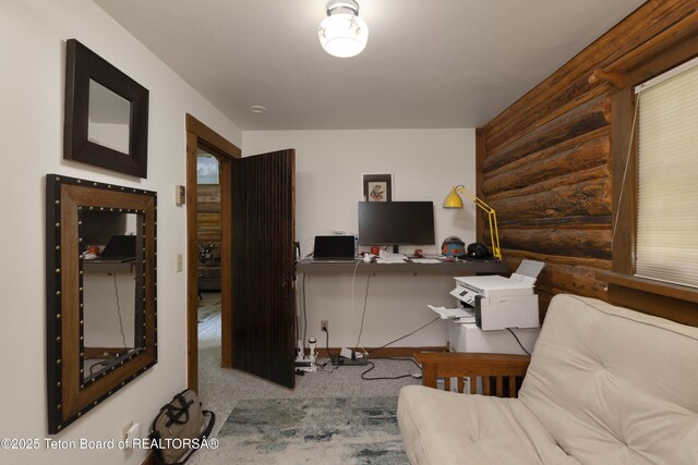 4075 Jarvis Ln, Wilson, WY 83014 - office area with rustic walls and carpet floors