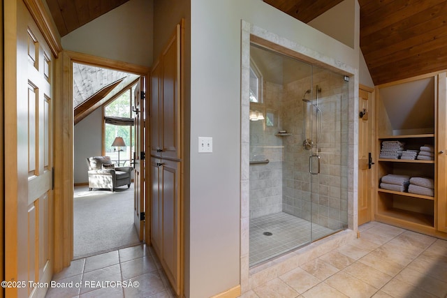 3065 N Mountain Maple Ln, Wilson, WY 83014 - bathroom featuring vaulted ceiling, wooden ceiling, a stall shower, and tile patterned floors