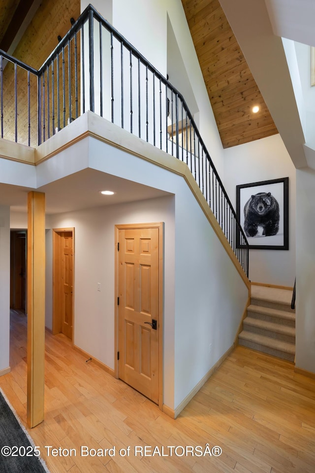 3065 N Mountain Maple Ln, Wilson, WY 83014 - staircase with a high ceiling, baseboards, hardwood / wood-style floors, and recessed lighting