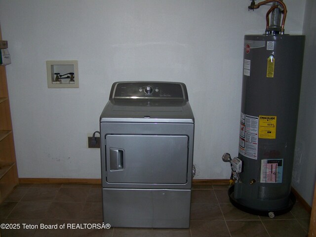 6 Opal St, Pinedale, WY 82941 - washroom featuring washer / clothes dryer, gas water heater, and tile patterned flooring
