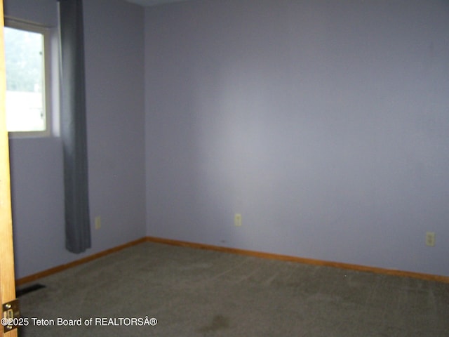 6 Opal St, Pinedale, WY 82941 - carpeted empty room featuring baseboards