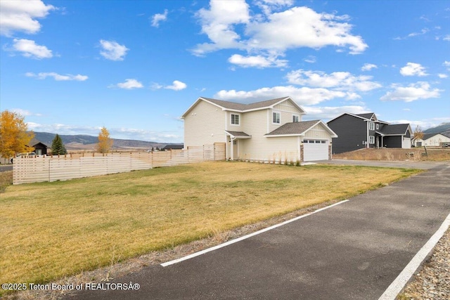 365 Little Greys Lp, Etna, WY 83118 - view of front of house featuring driveway and a garage