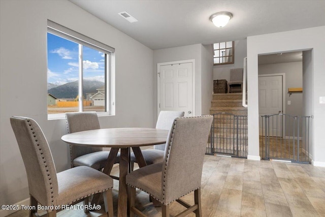 365 Little Greys Lp, Etna, WY 83118 - dining room featuring light wood-style flooring and stairs