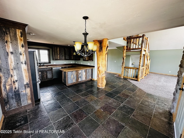 21 Hawk Path, Boulder, WY 82923 - kitchen featuring stainless steel appliances, baseboards, a chandelier, decorative light fixtures, and stone tile flooring