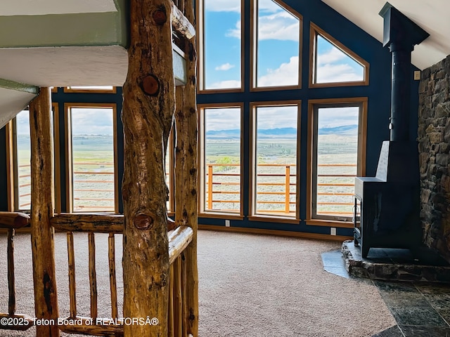 21 Hawk Path, Boulder, WY 82923 - detailed view of a wood stove, carpet, and a nearby body of water