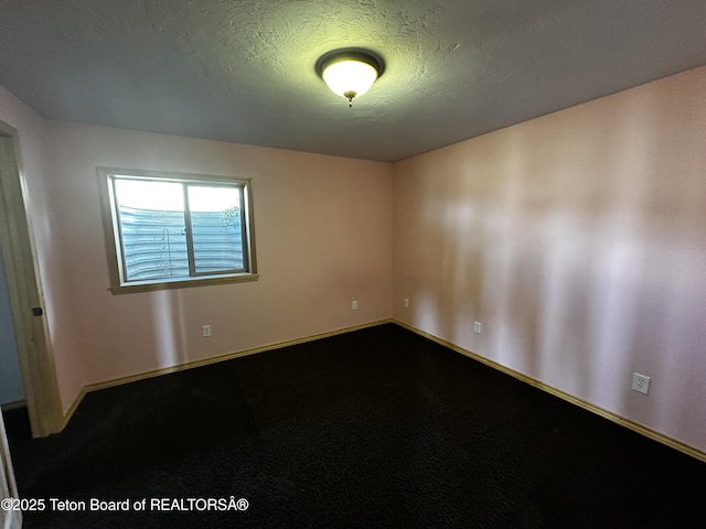 21 Hawk Path, Boulder, WY 82923 - unfurnished room featuring baseboards and a textured ceiling