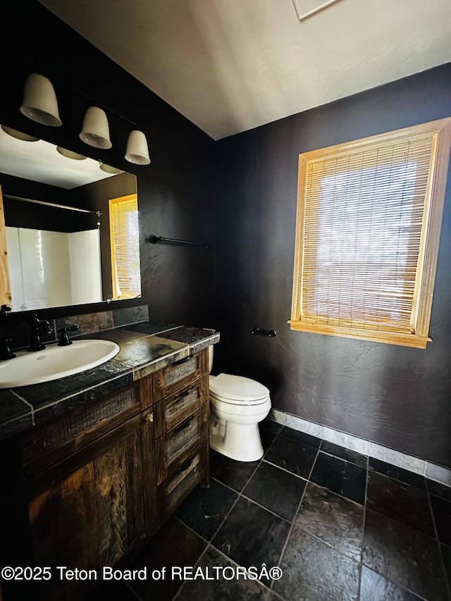 21 Hawk Path, Boulder, WY 82923 - bathroom featuring vanity, baseboards, and toilet