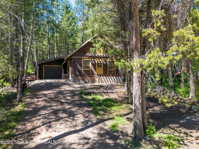 739 Pinecrest, Alpine, WY 83128 - chalet / cabin with driveway and a forest view