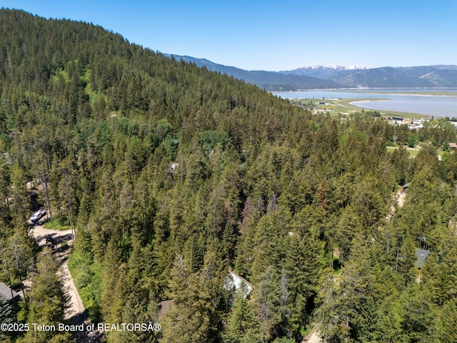 739 Pinecrest, Alpine, WY 83128 - view of mountain backdrop featuring a heavily wooded area and a large body of water
