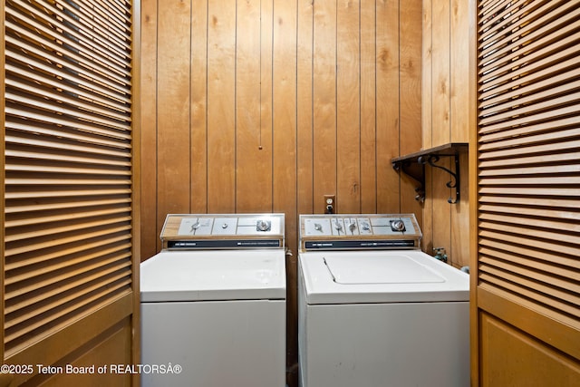 739 Pinecrest, Alpine, WY 83128 - washroom with washer and dryer and wood walls