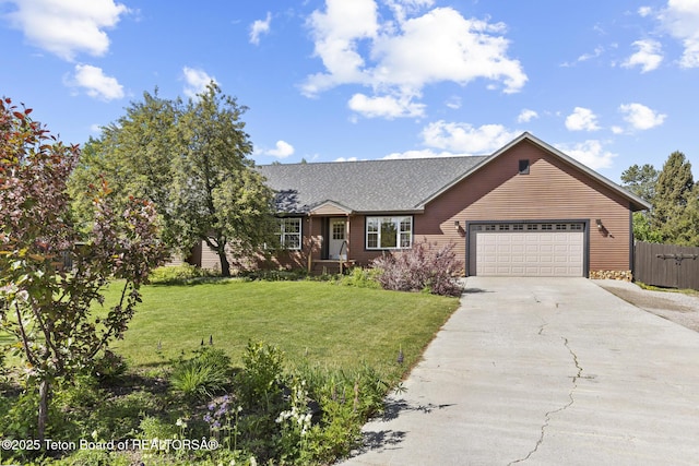 560 Appaloosa Trl, Driggs, ID 83422 - view of front of home with a garage, concrete driveway, and a shingled roof