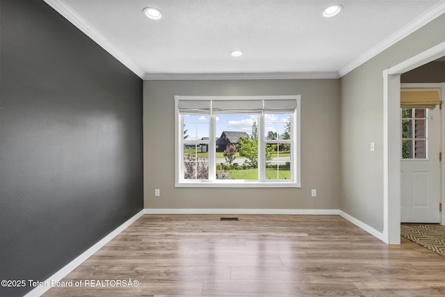 560 Appaloosa Trl, Driggs, ID 83422 - unfurnished room with ornamental molding, recessed lighting, baseboards, and wood finished floors