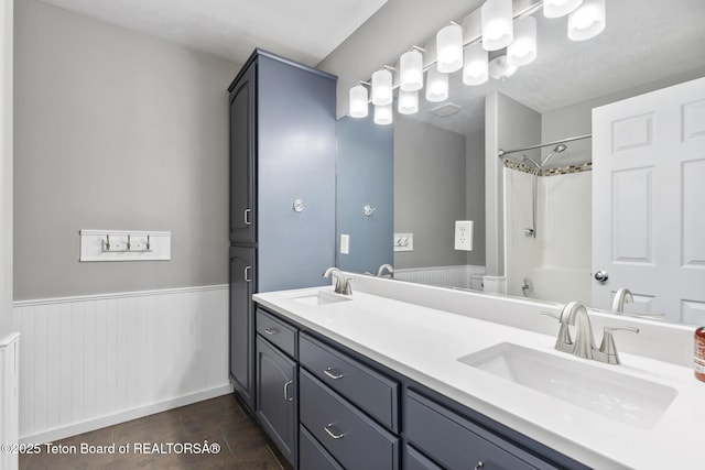 560 Appaloosa Trl, Driggs, ID 83422 - bathroom featuring double vanity, a wainscoted wall, and toilet