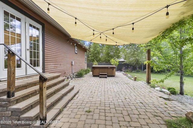560 Appaloosa Trl, Driggs, ID 83422 - view of patio featuring a hot tub and entry steps