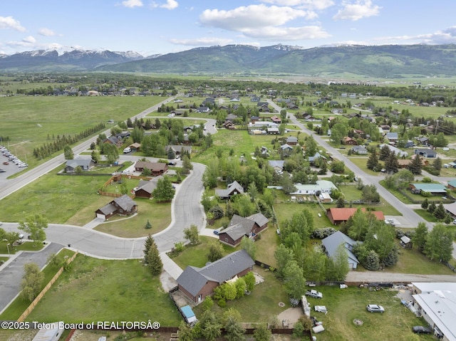 560 Appaloosa Trl, Driggs, ID 83422 - aerial overview of property's location featuring a mountainous background and nearby suburban area