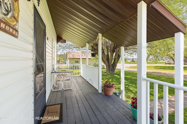 105 Heap Dr, Thayne, WY 83127 - wooden porch featuring a lawn